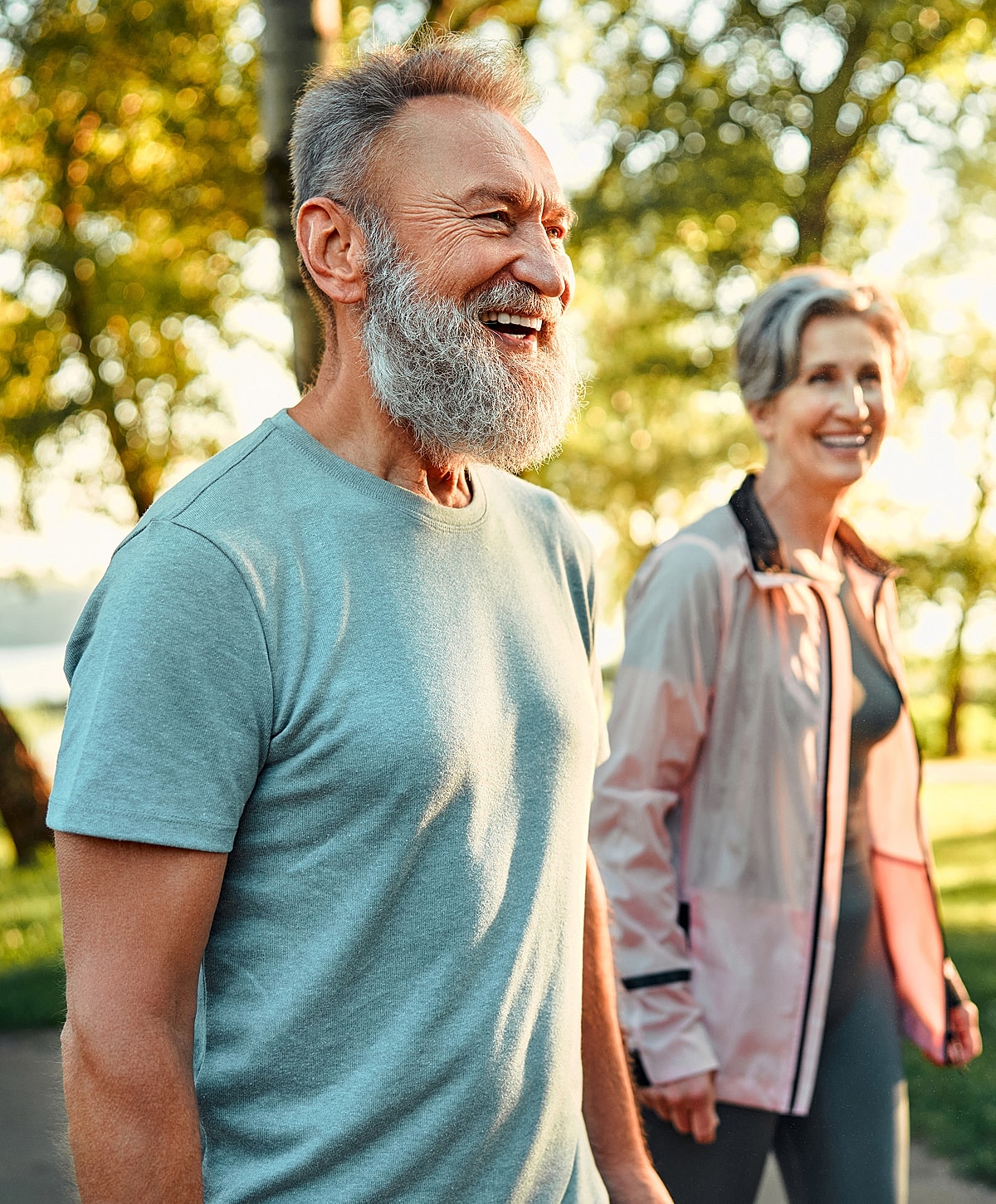 Happy senior couple enjoying a walk outdoors.