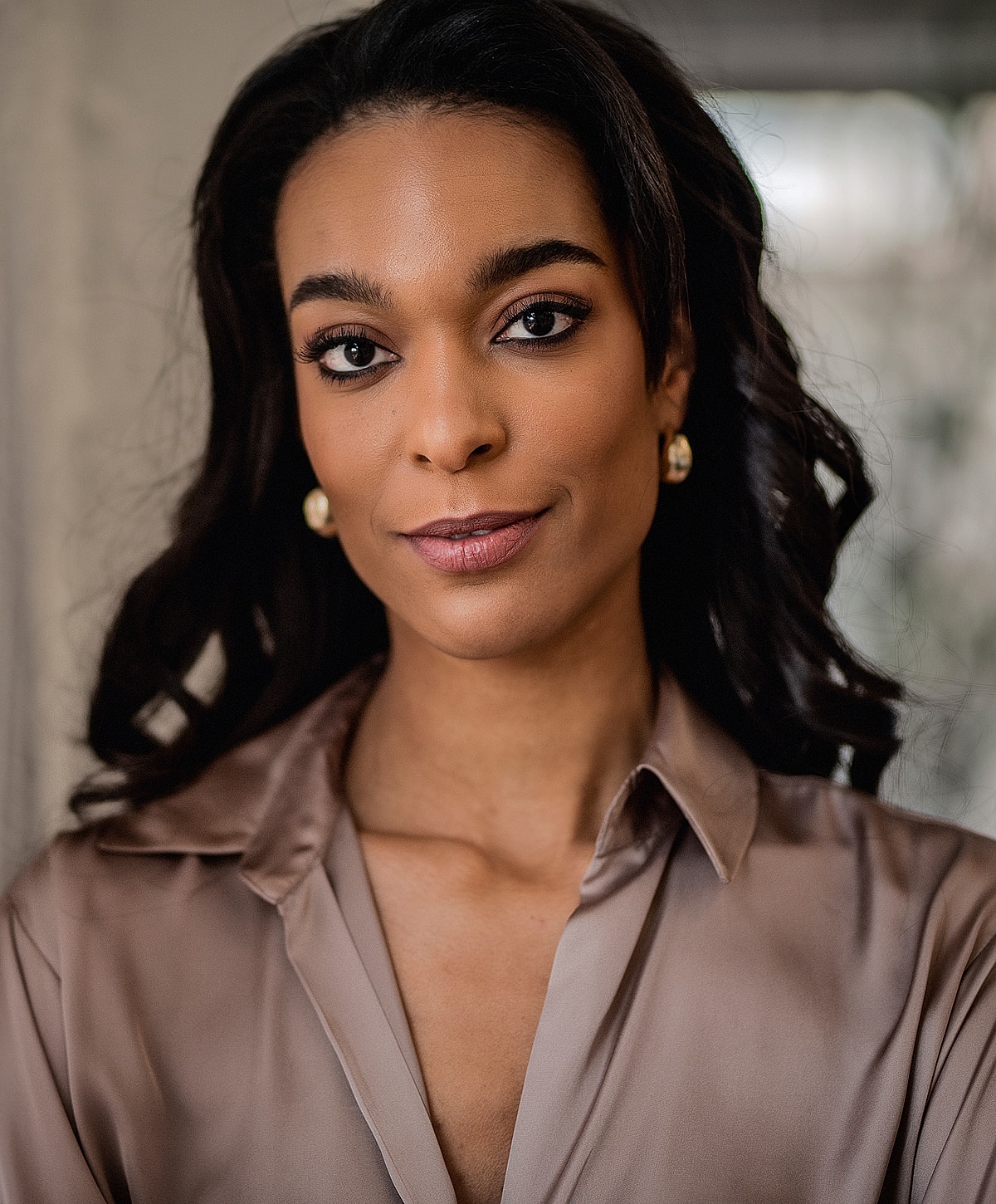 Portrait of a woman with wavy hair.