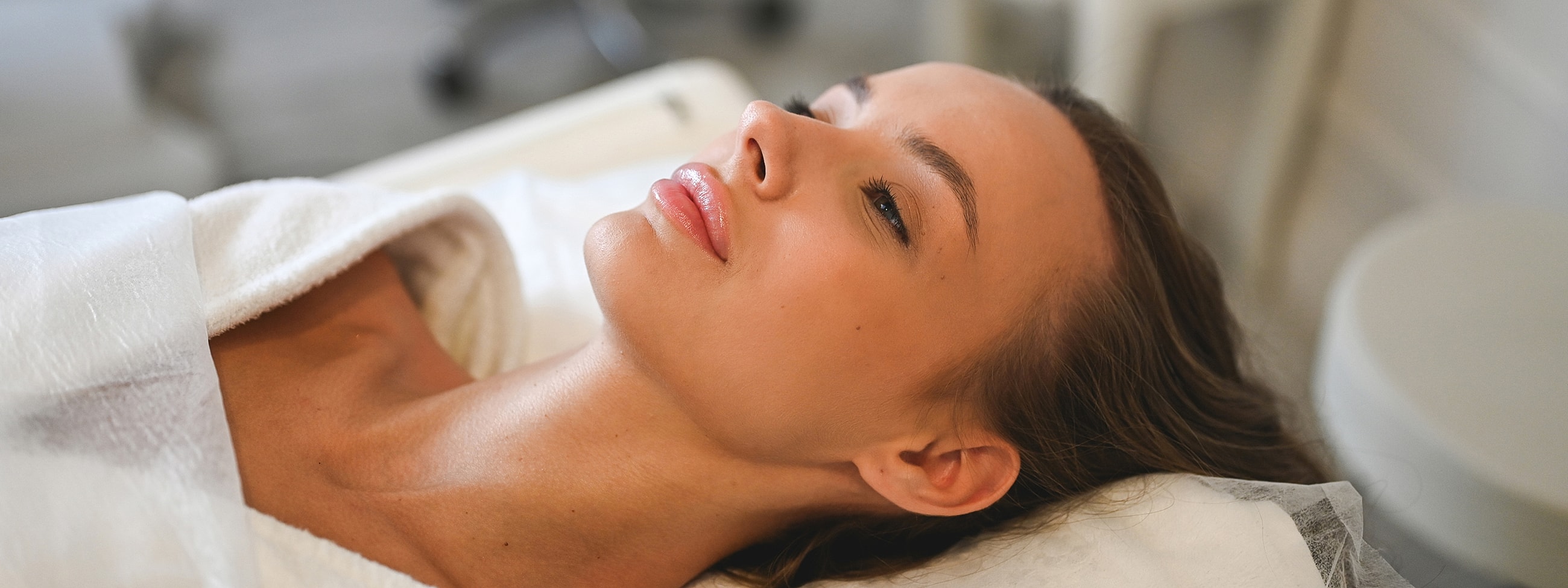 Woman relaxed during spa treatment session.