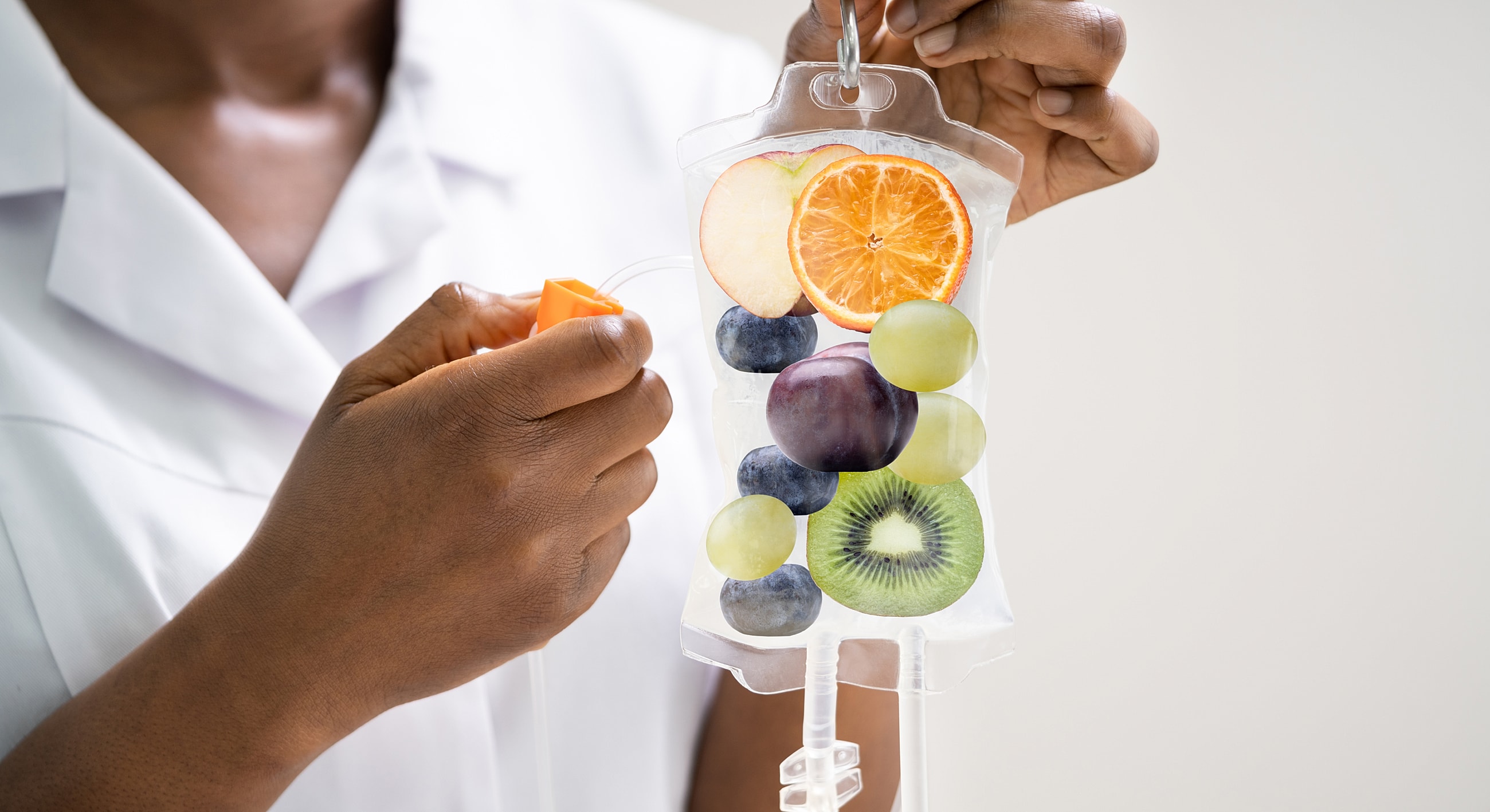 IV bag filled with colorful fruits and liquids.